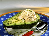 Avocado with nut ice cream and chopped pistachios on plate