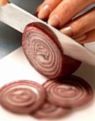 Cutting red onion into rings
