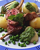 Lamb cutlets with potatoes, peas and green sauce