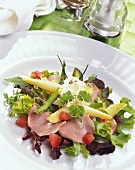 Green salad with pork loin, asparagus and horseradish