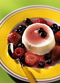 Panna cotta with mixed berries and red wine sauce