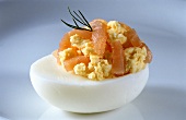 Stuffed egg with salmon and sprig of dill
