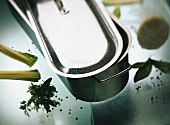 Stainless steel fish kettle with lid, herbs, peppercorns