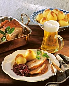 Roast pork with potato dumplings, red cabbage and beer