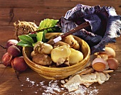 Jacket potatoes with knife, red cabbage, egg, roll, beetroot