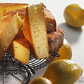 Ricotta cake with lemon in pieces on cake rack