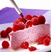 A piece of raspberry cheesecake