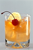 Whisky sour with lemon juice, lemon and Maraschino cherry