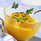 Creamy pumpkin soup with fresh parsley