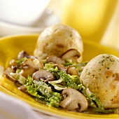 Bread dumplings with mushrooms and savoy