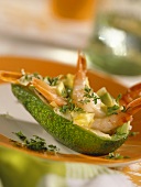 Avocado with crab salad, chicory and cress