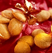 Sweet pastry biscuits, partly in cellophane paper with a bow