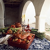 Roast leg of lamb with accompaniments & wine under arcade