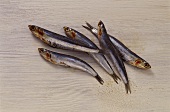 Sardines on white wooden background