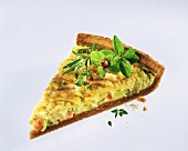 A piece of quiche with leeks and ham
