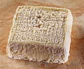 Lavzeral, a French goat's cheese, on brown background