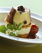 Chocolate pudding on champagne ice cream between cake bases