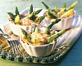 Asparagus tartlets with cheese on a tray