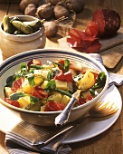 Potato salad with cucumber, salami and corn salad