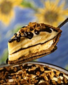 Frozen chocolate and cappuccino pie with chopped nuts
