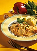 Szeged goulash with potatoes boiled in their skins