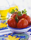 Fresh tomatoes with parsley in a bowl