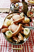 Meat platter with potatoes in their skins & sauerkraut