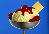 Vanilla ice cream with cherries and cherry sauce