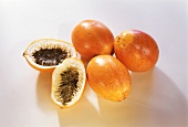 Passion fruits, one halved
