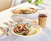 Chicken breast with apple, leek and couscous on two plates