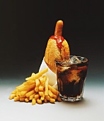 Hot dog with napkin, chips, ketchup and Coca Cola