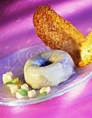 Poppy seed savarin with apple sauce and sesame wafers