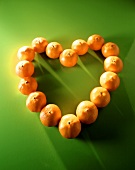 Mandarin heart on a green background