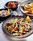 Vegetable salad with chicken, chick-peas, bacon cream & crisps