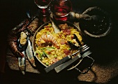 Paella with fish and seafood; Olives; Red wine