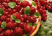 Raspberry and redcurrant tart with fresh mint