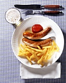 Sausages with chips, ketchup and beer