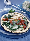 Flat bread with chicken breast, tomatoes and cucumber
