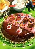 Pink beetle cake with coloured sugar pearls & chocolate drops