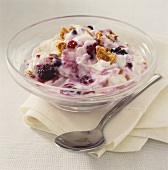 Yoghurt with berries in a glass bowl