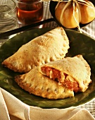 Tomato and cheese pasties on plate