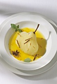 Poached pear in saffron sauce with star anise