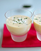 Cold savoury melon and yoghurt soup in two glasses