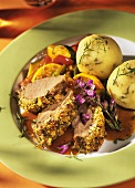 Roast lamb with sage dumplings and peppers & courgettes