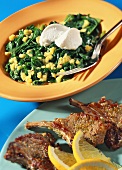 Spinach salad with soft cheese and mango salsa; lamb cutlets