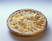 Whole apple tart with icing sugar