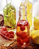 Raspberry vinegar, basil vinegar & lemon vinegar in bottles