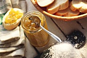 Gooseberry jam in jar and on slice of white bread