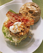 Roll with burger, poached egg and bacon