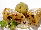 Pancake with raisins, pistachio ice cream & mint leaves